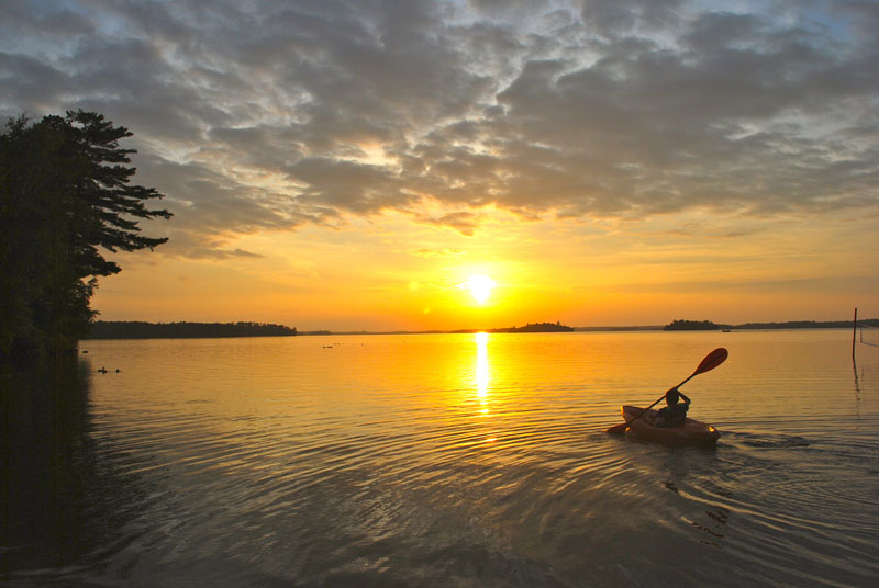 kayaker at sunset
